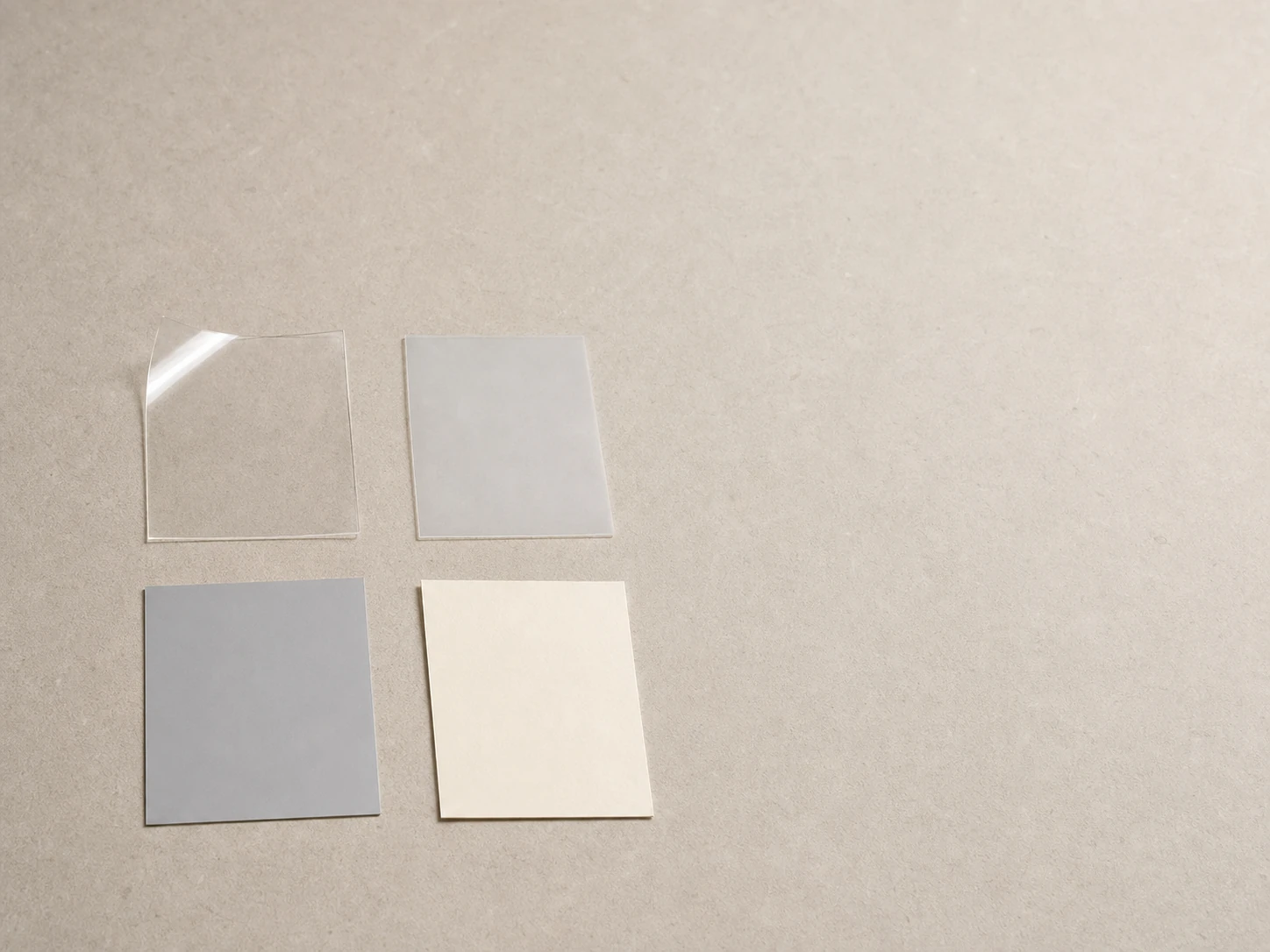 Illustrative unbranded clear, frosted, silver-gray and ivory flexible-material study.