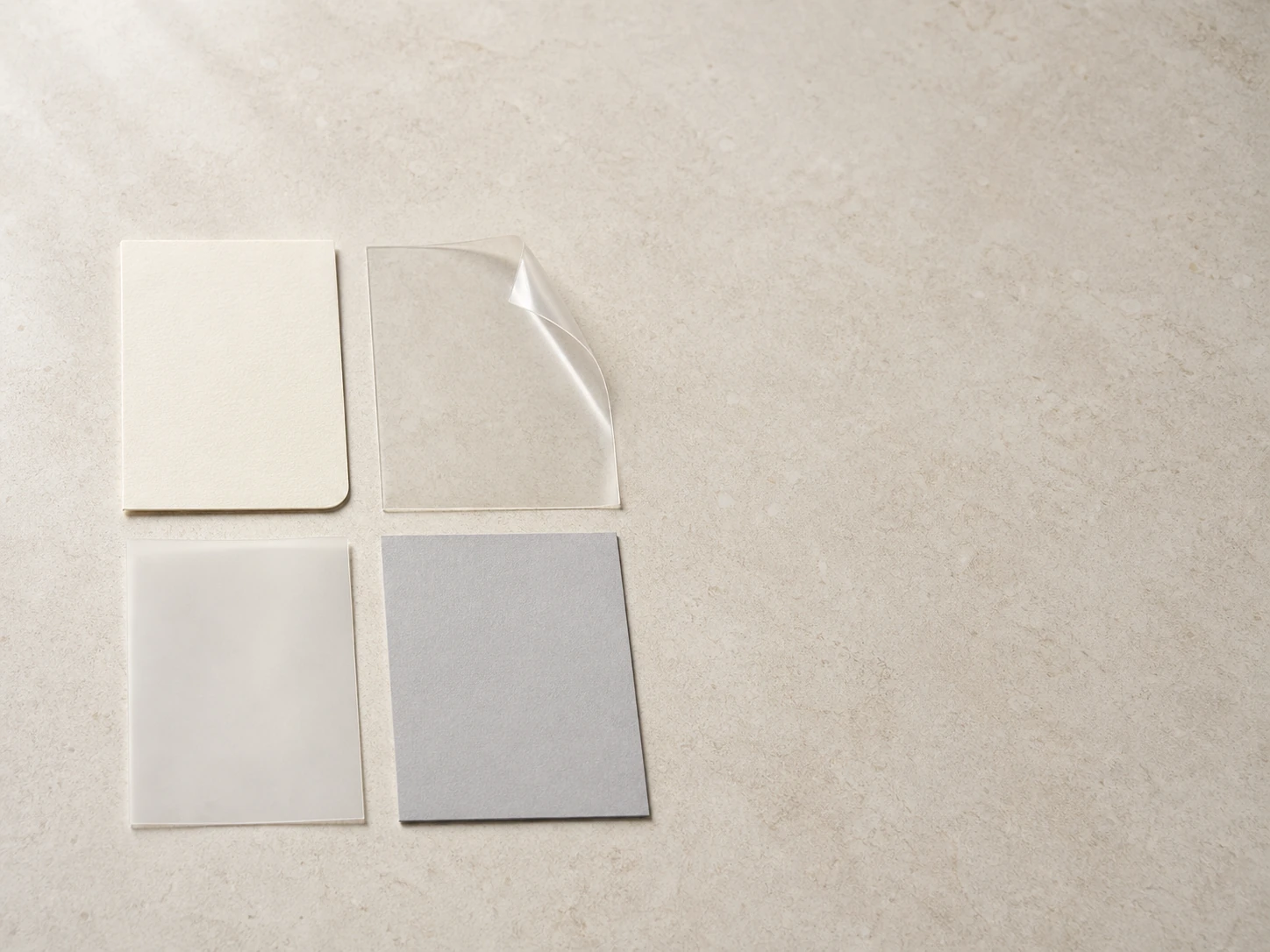 Illustrative unbranded paperboard, clear film, frosted film and dove-gray material study.